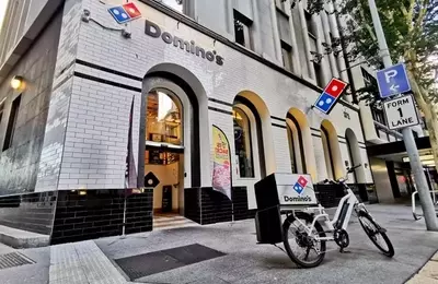 Domino's Pizza Faces Significant Challenges, Downgraded to 'Sell'